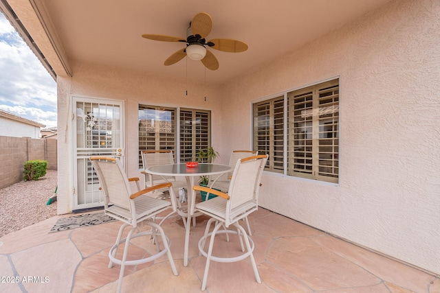 view of patio featuring ceiling fan