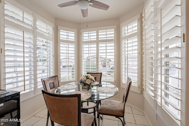 dining room with light tile patterned floors and ceiling fan