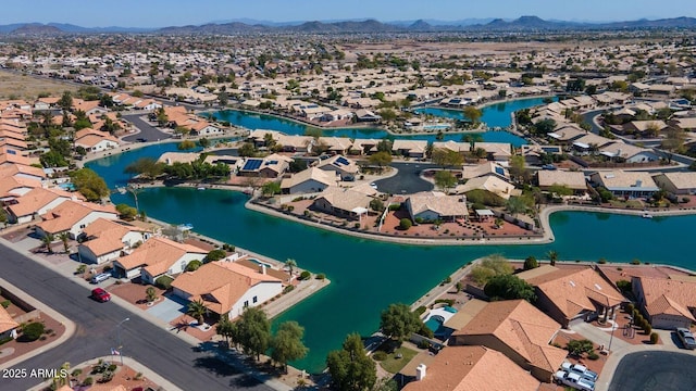 birds eye view of property featuring a water and mountain view