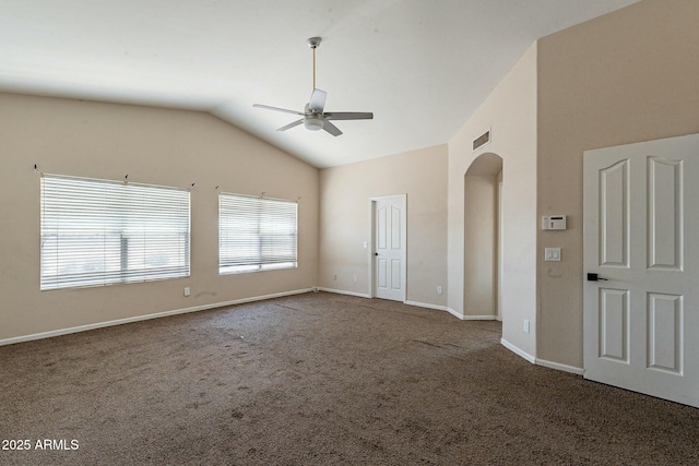 empty room with visible vents, carpet, baseboards, a ceiling fan, and lofted ceiling