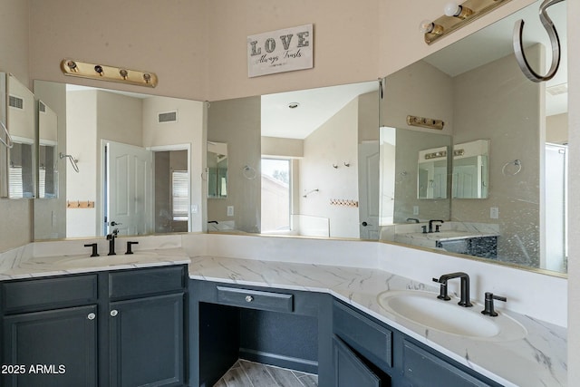full bathroom featuring visible vents and vanity