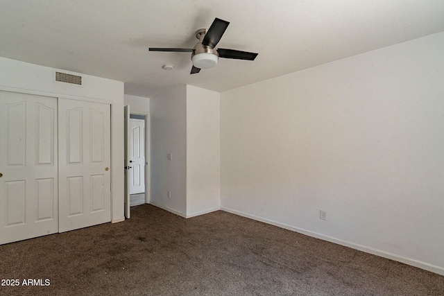 unfurnished bedroom with a closet, visible vents, baseboards, ceiling fan, and carpet floors