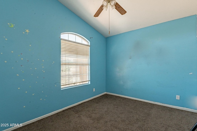 unfurnished room with carpet flooring, a ceiling fan, plenty of natural light, and vaulted ceiling