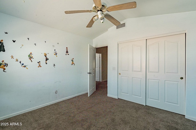 unfurnished bedroom with vaulted ceiling, a closet, baseboards, visible vents, and carpet