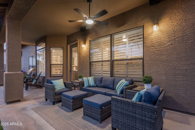 view of patio featuring an outdoor living space and ceiling fan