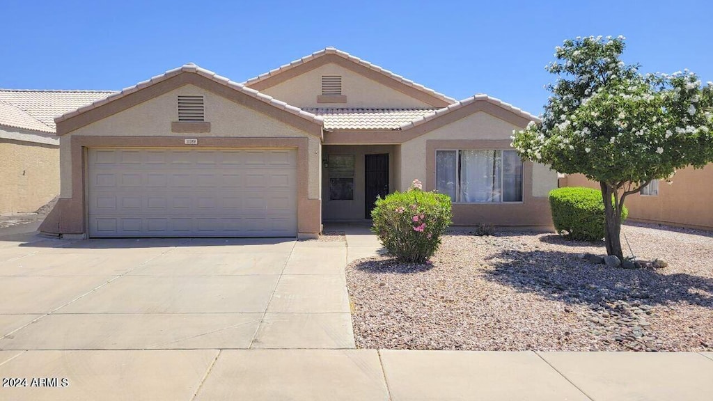 ranch-style home with a garage