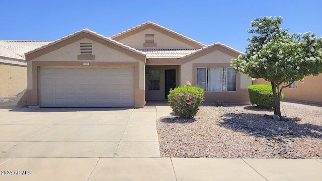 ranch-style home with a garage