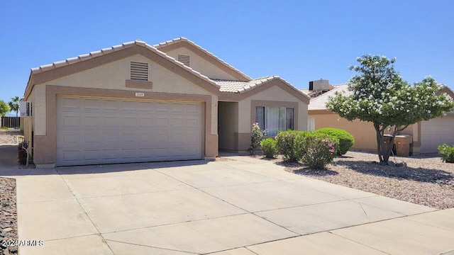 single story home featuring a garage