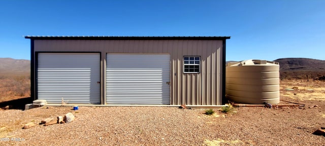 view of outdoor structure featuring an outbuilding and a mountain view