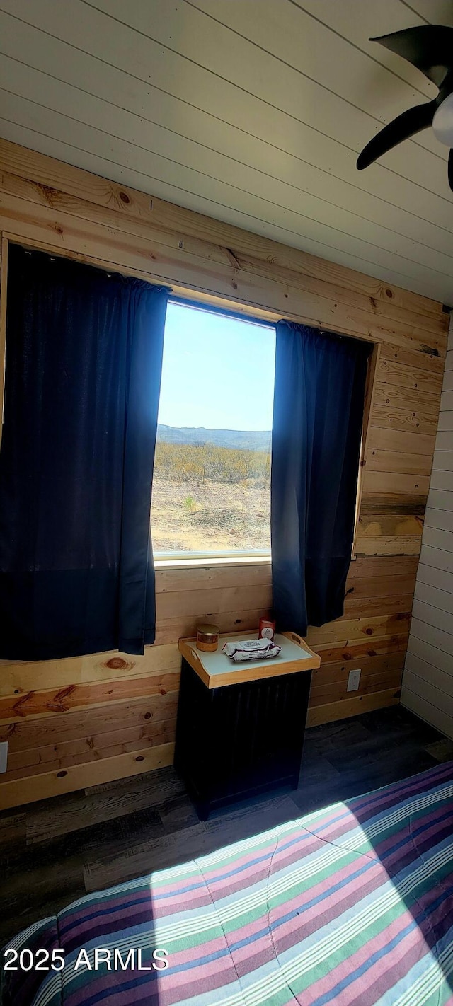 unfurnished bedroom with wooden walls