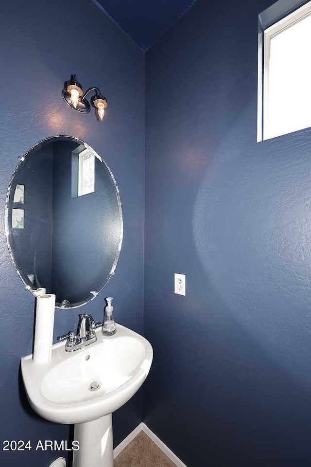 bathroom with sink and a healthy amount of sunlight