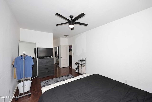 unfurnished bedroom featuring ceiling fan and dark hardwood / wood-style floors