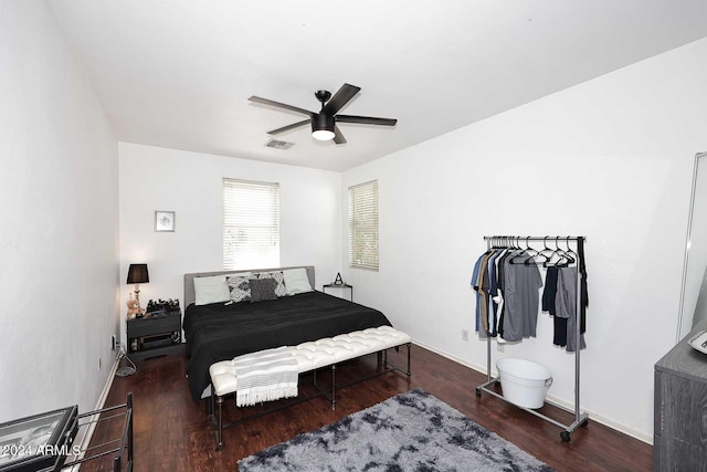 bedroom with ceiling fan and dark hardwood / wood-style floors