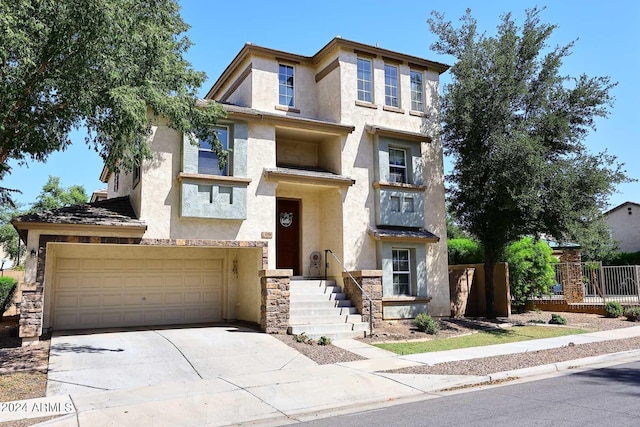 4306 E Tyson St, Gilbert, AZ 85295 - view of front of house featuring driveway, stucco siding, fence, and stone siding