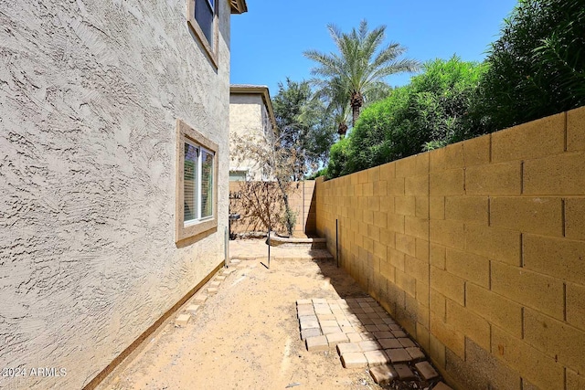 4306 E Tyson St, Gilbert, AZ 85295 - view of home's exterior with a fenced backyard and stucco siding