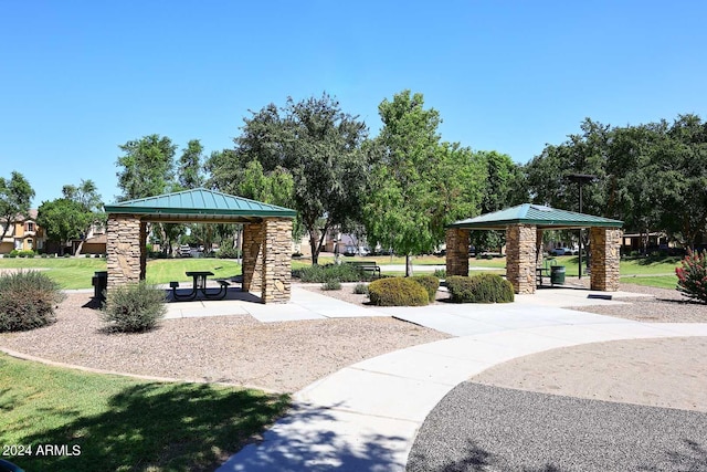 surrounding community featuring a gazebo and a lawn