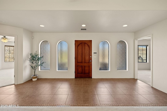 foyer entrance with tile patterned flooring, recessed lighting, a healthy amount of sunlight, and a ceiling fan