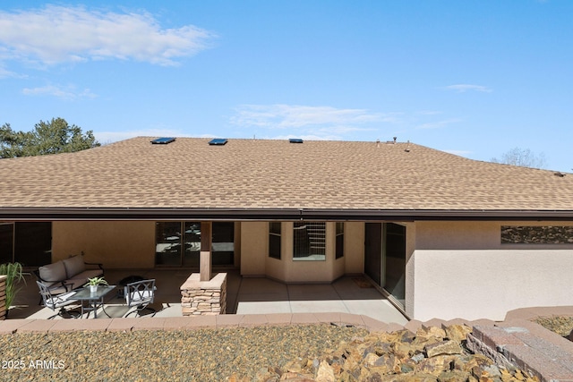 back of property featuring a patio, an outdoor hangout area, stucco siding, and a shingled roof