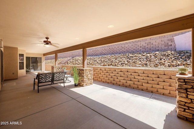 view of patio featuring ceiling fan