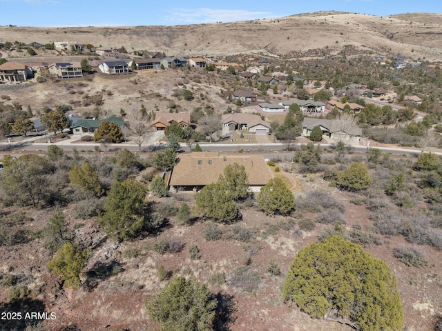 drone / aerial view featuring a mountain view and a residential view