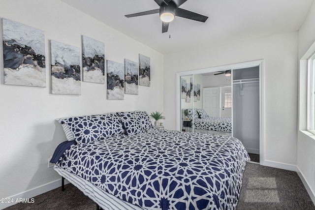 bedroom with a closet, ceiling fan, and dark carpet