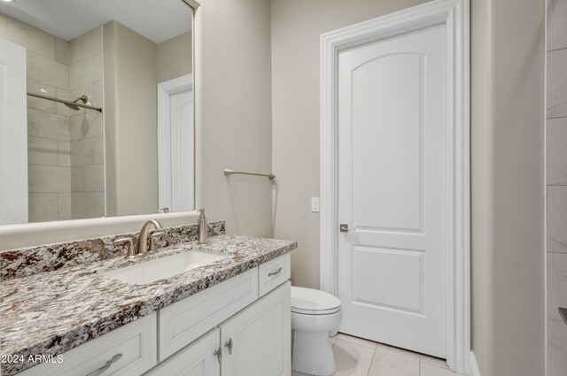 full bathroom with shower / bath combination with curtain, tile patterned floors, vanity, and toilet