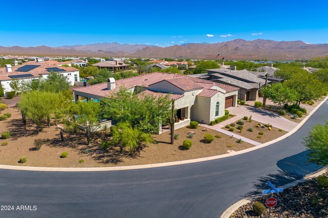 view of swimming pool featuring a mountain view, an in ground hot tub, and a patio area