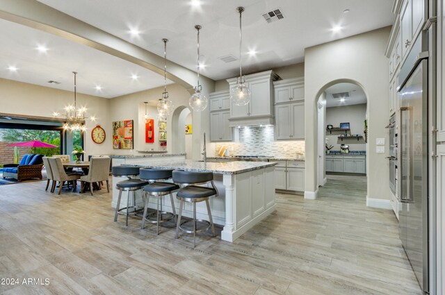 office area with ceiling fan and light hardwood / wood-style flooring