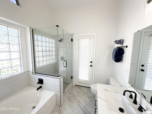 full bathroom with independent shower and bath, vanity, and toilet