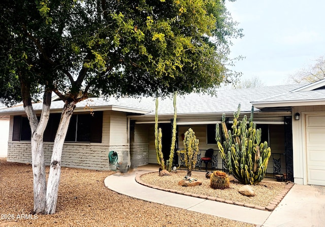 ranch-style home with a garage