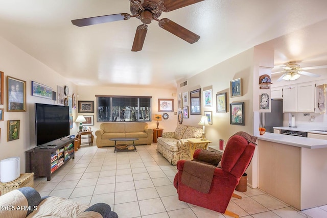 tiled living room with ceiling fan