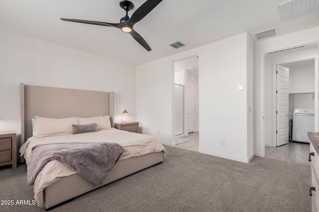 carpeted bedroom featuring connected bathroom, ceiling fan, and washer / dryer