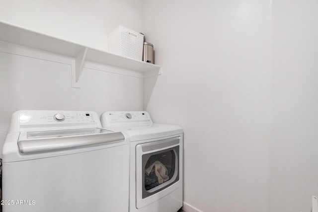 laundry room with washer and clothes dryer