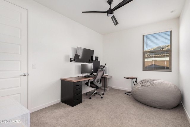 home office with ceiling fan and light colored carpet