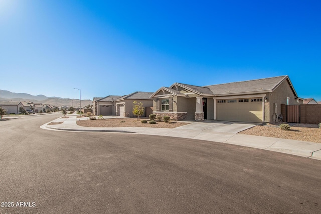 view of front of house with a mountain view and a garage