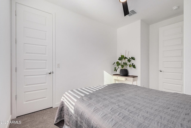 bedroom featuring ceiling fan and light carpet