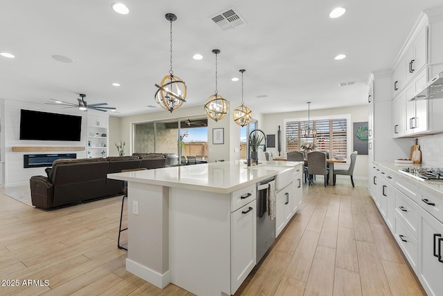 kitchen featuring visible vents, recessed lighting, stainless steel appliances, and light countertops