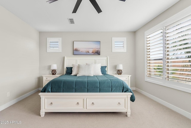 bedroom featuring visible vents, multiple windows, and baseboards