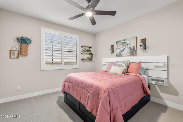 carpeted bedroom featuring baseboards and ceiling fan