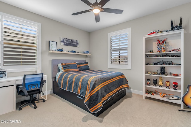 bedroom featuring baseboards, carpet floors, and a ceiling fan