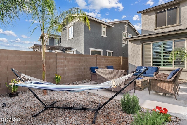 view of patio featuring an outdoor hangout area and fence