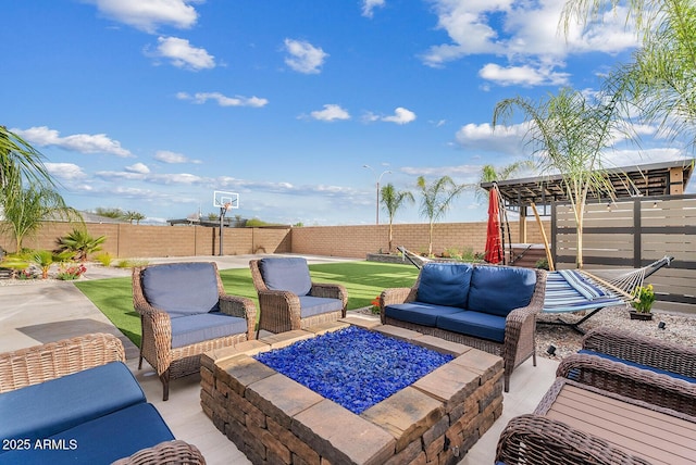 view of patio featuring an outdoor living space with a fire pit and a fenced backyard