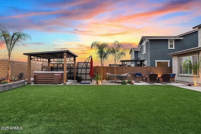 view of yard featuring a gazebo, a patio area, a fenced backyard, and a hot tub