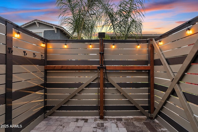 view of gate at dusk