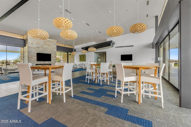 dining space featuring a high ceiling