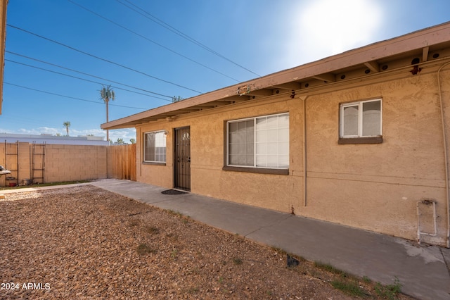 view of side of property with a patio