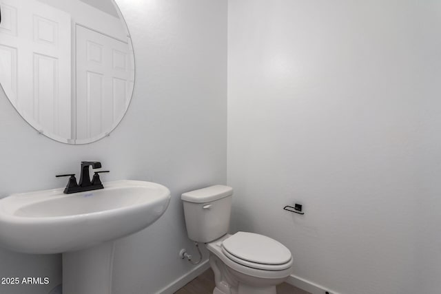 bathroom with toilet and sink