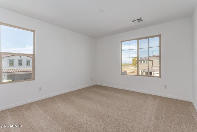 unfurnished room featuring carpet