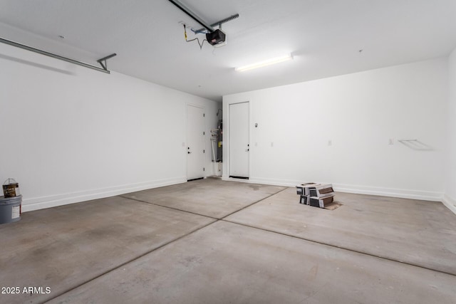 garage featuring a garage door opener and gas water heater