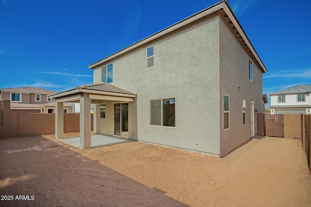 rear view of property with a patio